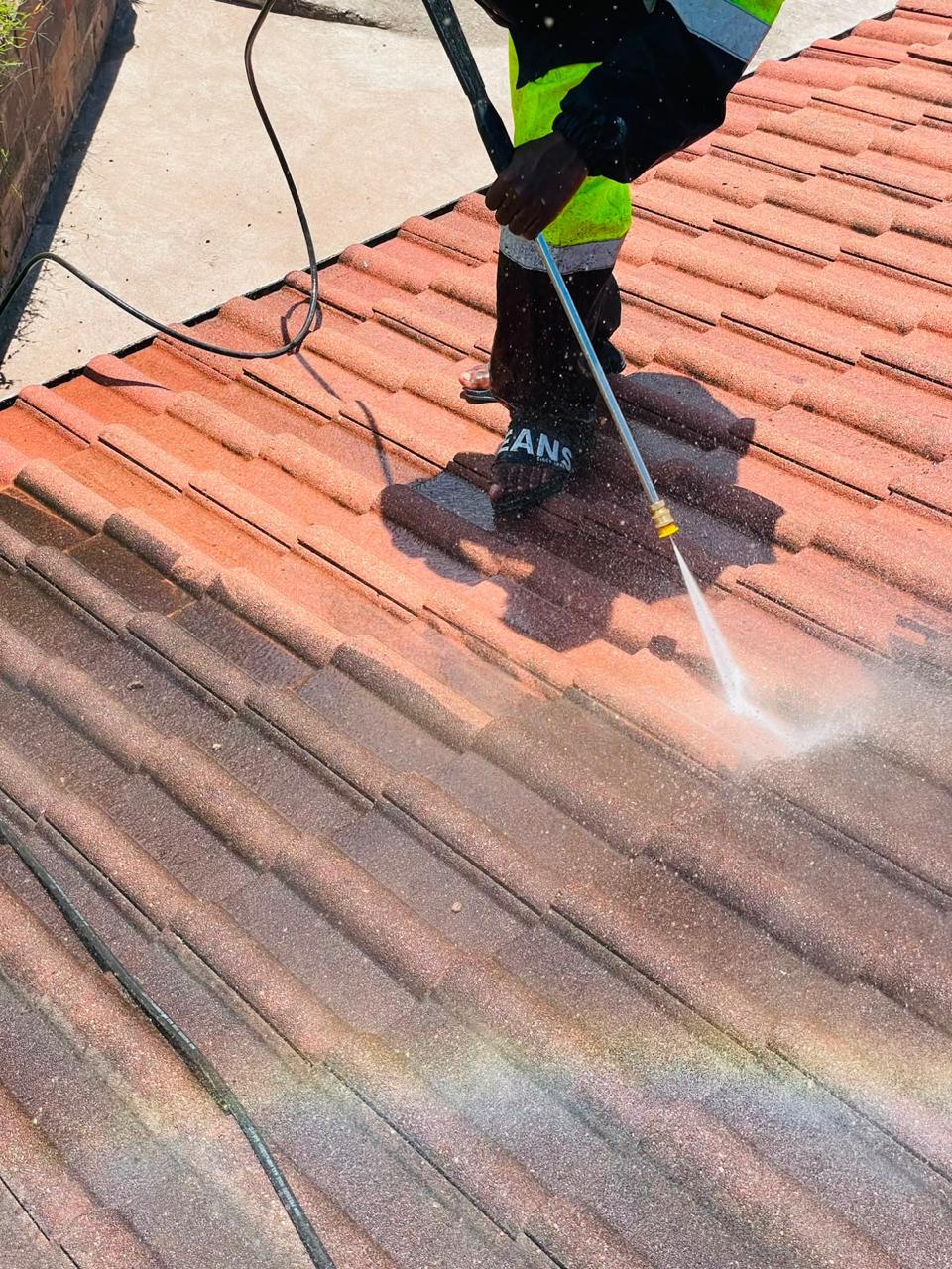 High pressure roof cleaning in progress